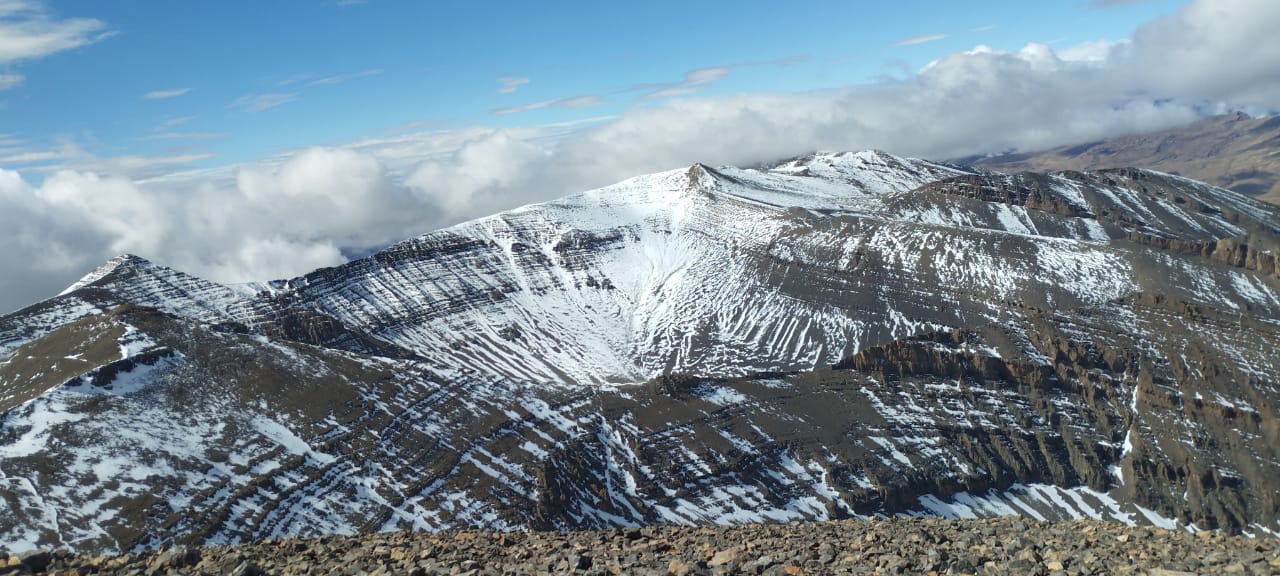 Hikers reaching Mount Toubkal summit on a 2-day trek from Imlil, Morocco