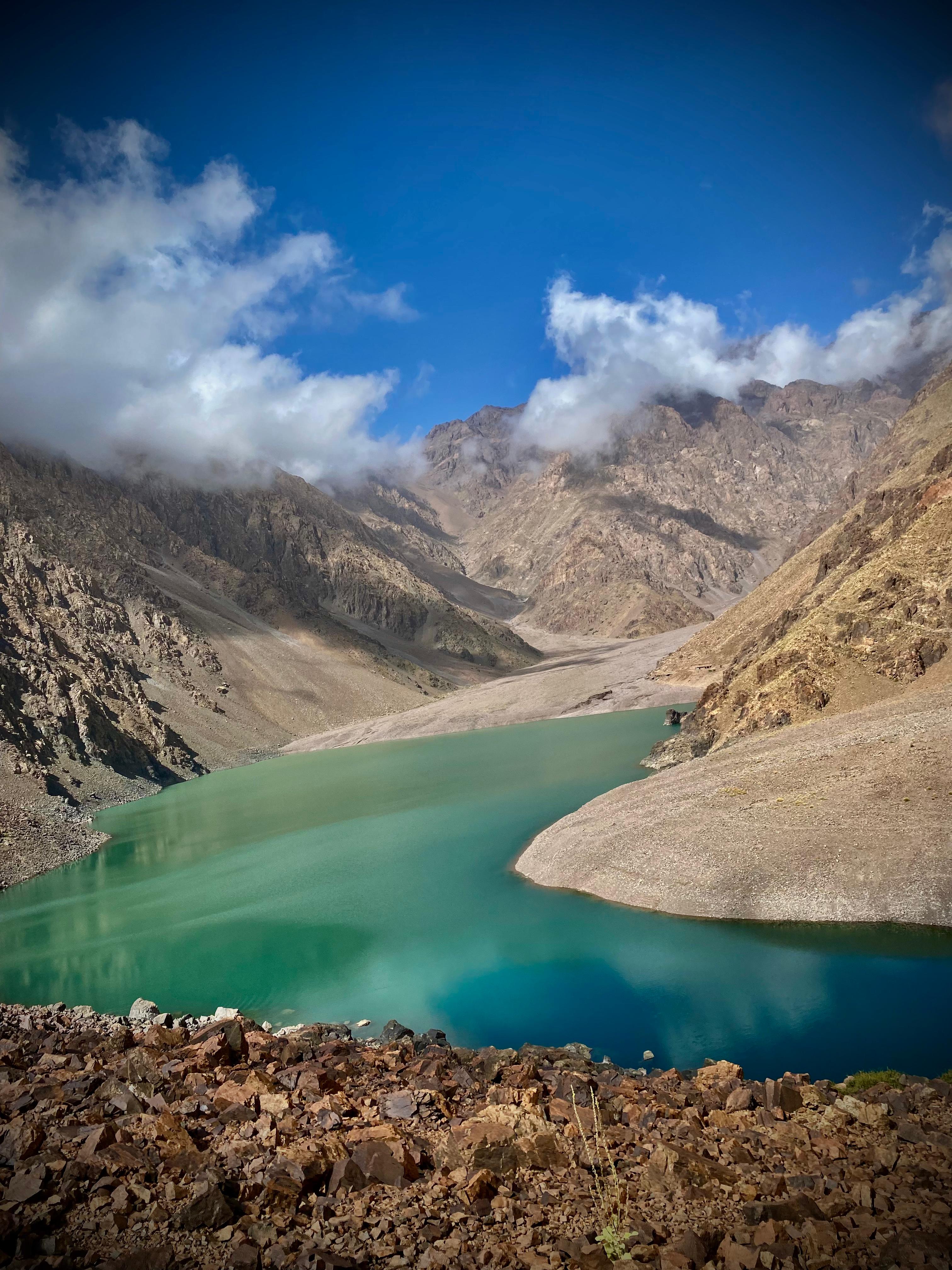 Trekking in the High Atlas Mountains, Morocco with Mount Toubkal summit.